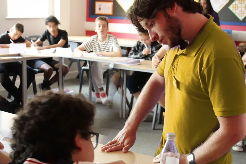 English teacher assisting student