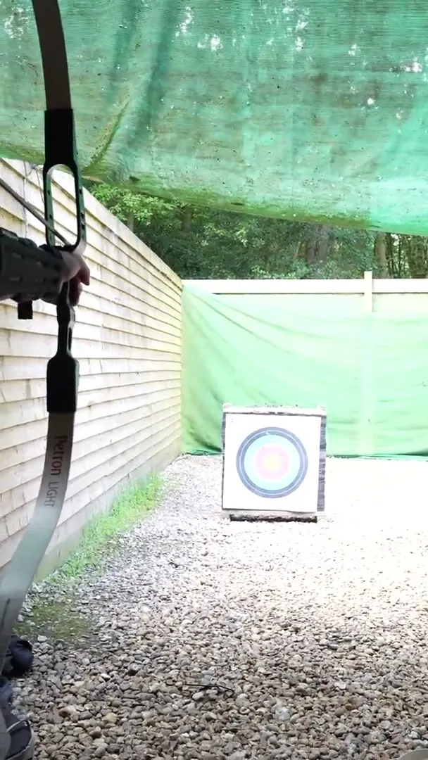 Archery practice hitting the bullseye at camp.