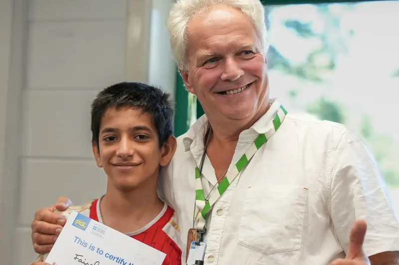 Student receiving British Council certificate