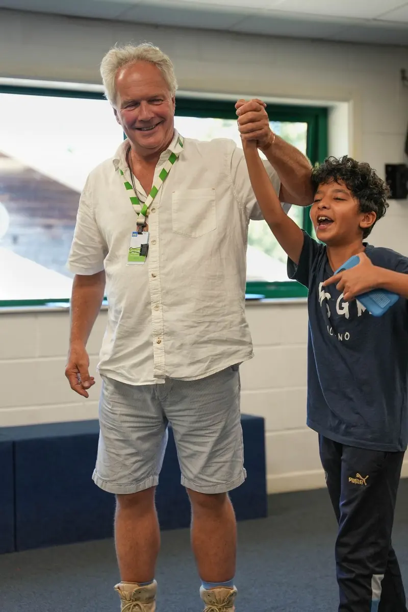 Instructor celebrating with student